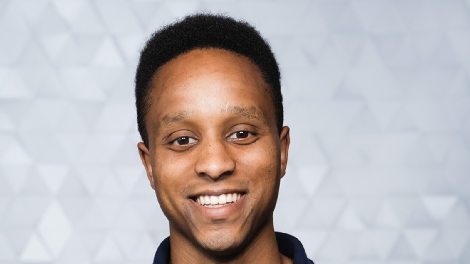 a person smiling at the camera