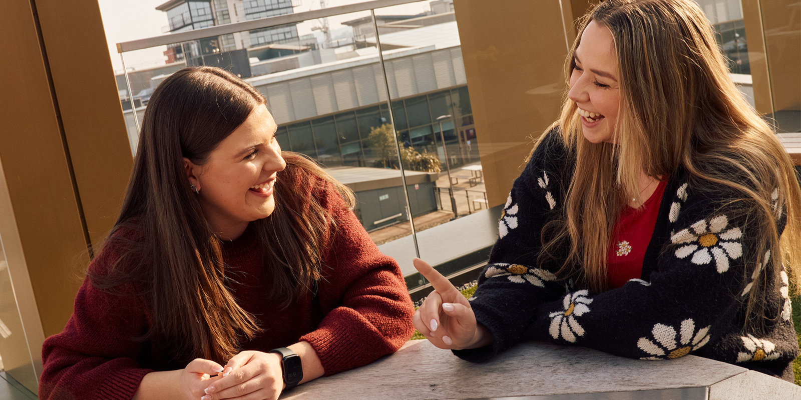 two women sitting at a table