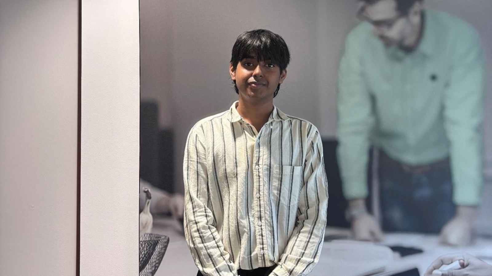 a person standing in front of a picture