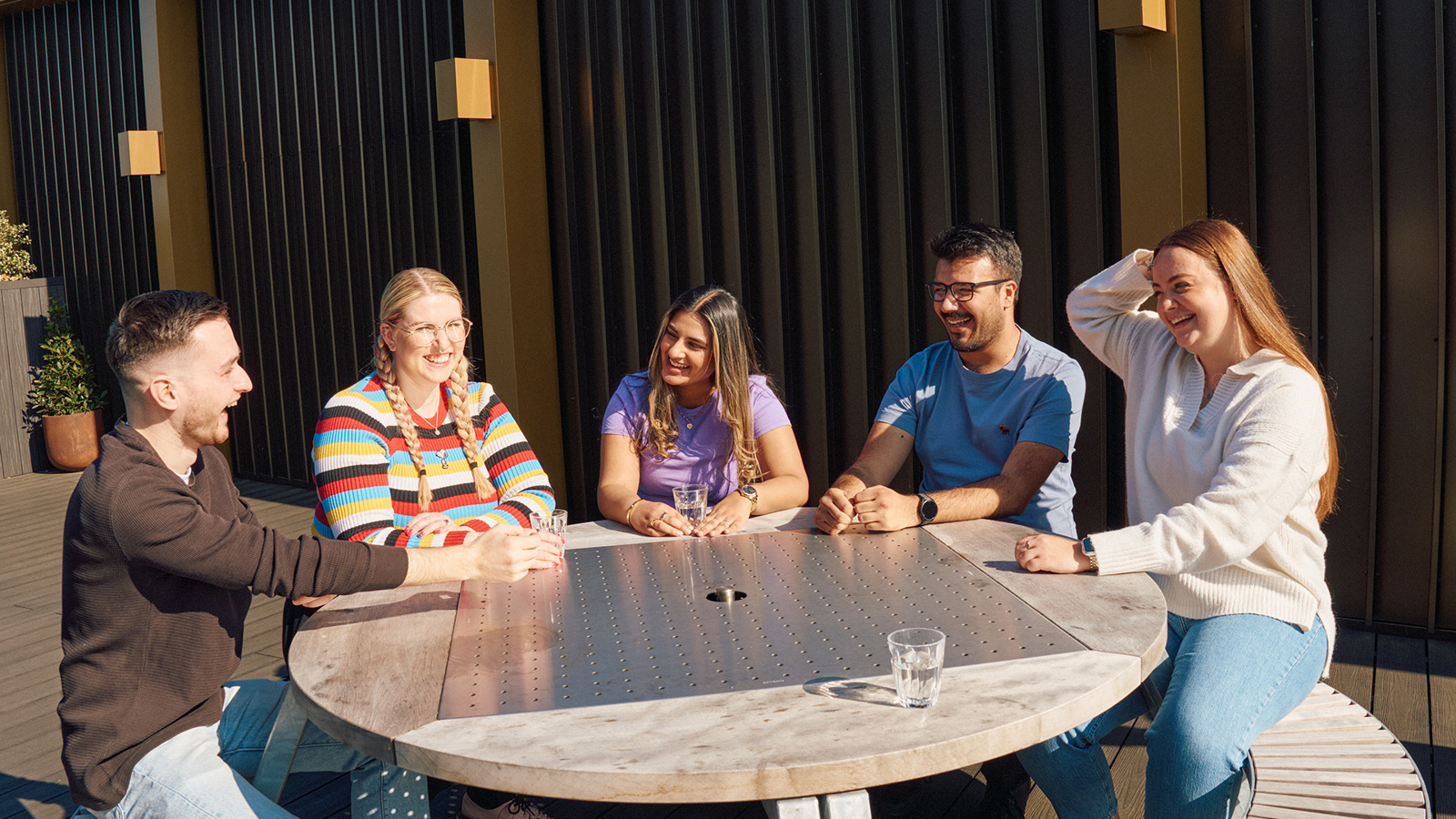 a group of people sitting around a table